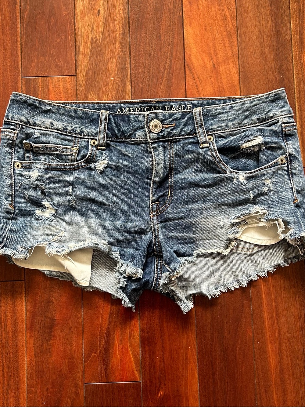 **American Eagle Distressed Denim Shorts (Size 10)**
